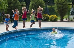 Kids jumping in a pool representing the real estate market