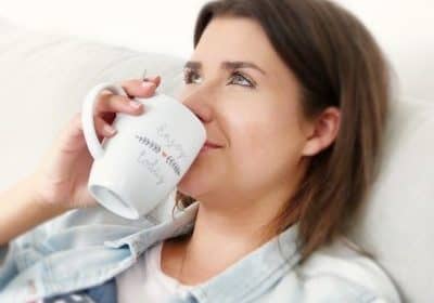 Woman slowing down and drinking coffee